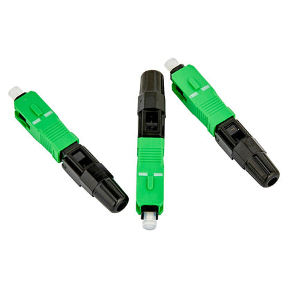 Three fiber optic connector adapters with bright green and black bodies, shown on a plain white background.
