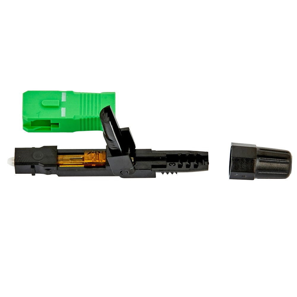 A black fiber optic connector tool with a green protective cap and a separate black cap placed beside it on a white background.